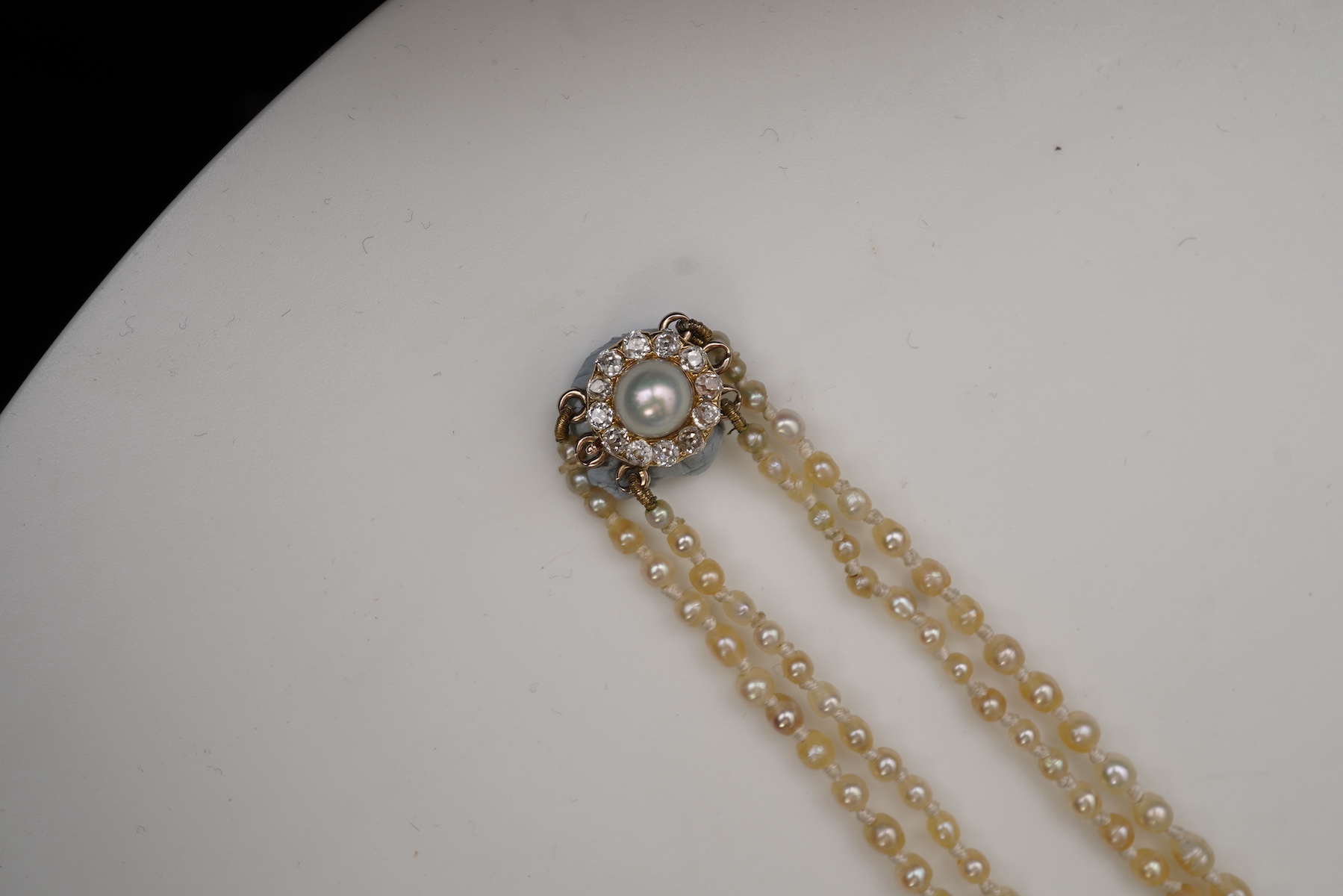 A natural pearl and diamond necklace, early 20th century